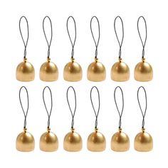 twelve brass bell ornaments hanging from black cord