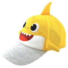 a yellow hat with a shark face on it