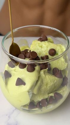 a bowl filled with ice cream and chocolate chips