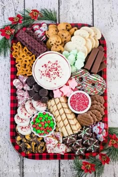 a platter filled with christmas treats and cookies