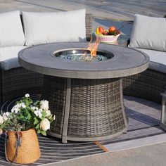 a fire pit sitting on top of a patio table