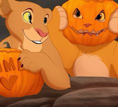 the lion and the mouse are holding pumpkins