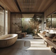 a bathroom with a large bathtub next to two sinks