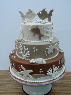 three tiered cake with sea animals on it