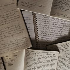 many old notebooks with writing on them