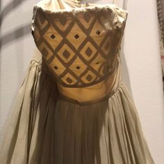 the back of a dress on display in a museum