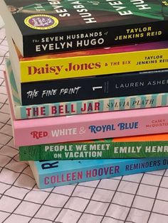 a stack of books sitting on top of a table