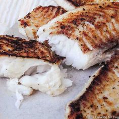 grilled fish fillets on a paper plate