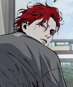 a man with red hair is staring at something