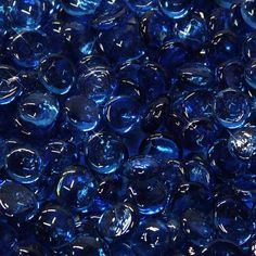 blue glass marbles are shown in close up