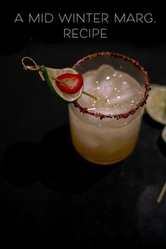 a drink in a glass with a red pepper on the rim and lime slices around it