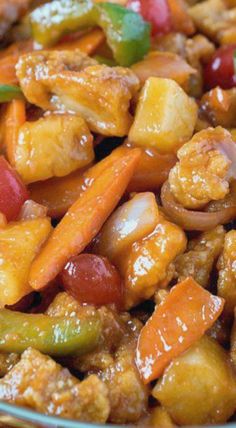 a close up of a plate of food with meat and vegetables in it on a table