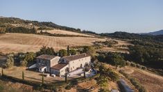 an aerial view of a house in the countryside