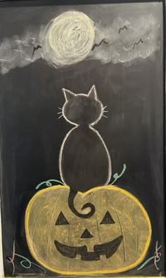 a chalk drawing of a cat sitting on top of a pumpkin