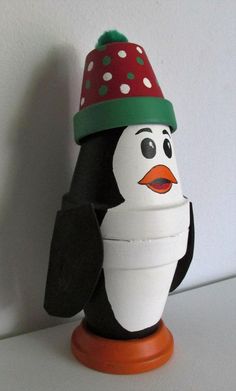 a penguin wearing a red and green hat