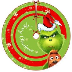 the grinch christmas ornament is hanging from a circular decoration with snowflakes