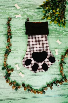 a christmas stocking hanging on a wooden table