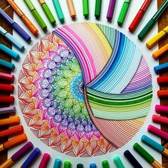 colored crayons are arranged in the shape of a circle