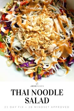 thai noodle salad in a white bowl with peanut sauce on top and the words, thai noodle salad 21 day fix + 28 mindset approved