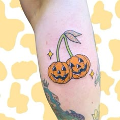 two jack o lantern pumpkins on the leg