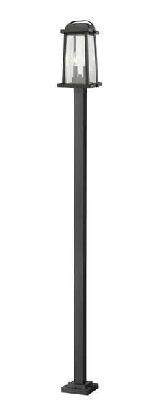 a black lamp post with two lights on each end and one light on the other side