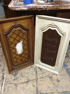 two framed pictures with the words happy new year and an empty sign in front of them