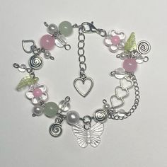 a bracelet with charms and hearts on it