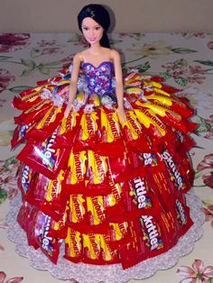 a barbie doll in a dress made out of candy bars