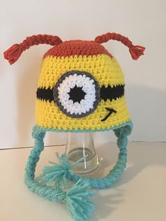 a crocheted hat with an eyeball on it