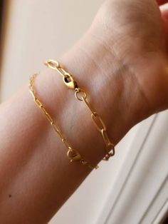 Gorgeous and trendy gold paperclip bracelets..Made from gold and matte gold plated chain, gold and matte gold plated lobster clasps...soo pretty alone or LAYERED with the gem bead bracelets! ~~7 inches in length  ~~Large bracelet can be made smaller, lobster clasp fits in the links~ ~~sold separately 👉IF YOU WANT AN EXTENDER OR A DIFFERENT SIZE, ADD IT IN THE NOTES SECTION AT CHECKOUT👈 **SEE LAST 2 PHOTOS FOR LAYERING IDEAS** STACK✨ LAYER ✨ LOVE Everyday Gold-tone Paperclip Bracelet With Lobster Clasp, Gold Paperclip Bracelet With Lobster Clasp, Modern Gold Paperclip Bracelet With Lobster Clasp, Minimalist Gold Paperclip Bracelet With Lobster Clasp, Minimalist Gold-tone Paperclip Bracelet With Oval Links, Everyday Gold-tone Paperclip Bracelet With Cable Chain, Gold Chain Link Paperclip Bracelet With Lobster Clasp, Gold-tone Link Paperclip Bracelet With Lobster Clasp, Gold-tone Paperclip Bracelet With Lobster Clasp