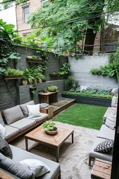 an outdoor living area with couches, tables and potted plants