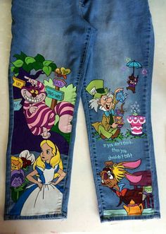 a pair of jeans with cartoon characters painted on them