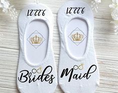 two pairs of shoes that say bride's maid and the other pair has a crown on them