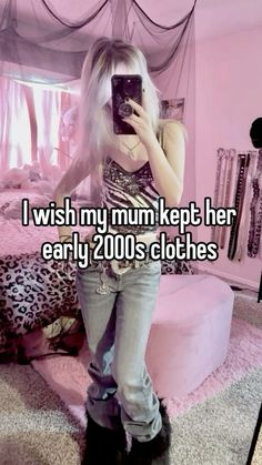 a woman taking a selfie in her bedroom with the caption i wish my mum kept her early 2000's clothes