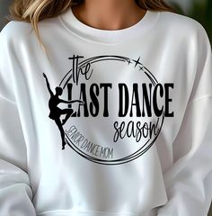 a woman wearing a white sweatshirt with the last dance season printed on it