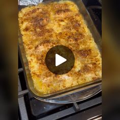 a casserole dish is being cooked on the stove with a video play button