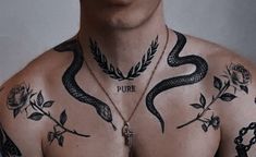 a man with a snake tattoo on his chest