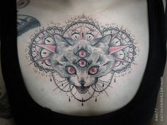 a woman's stomach with a tattoo on it and an image of a wolf