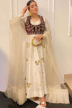 Exquisitely embroidered with hand & machine work, this off-white silk Anarkali suit which will make you absolutely classy. This round neck and full sleeve clothing is designed using stone and zari work. Available with lycra churidar in off white color with off white net dupatta. Churidar is plain. Dupatta is decorated using stonework. Make your look more royal by velvet pure maroon jacket adorned with stone and handwork. This Anarkali suit can be customized up to maximum size available in in White Net Dupatta, Pakistani Wear, Maroon Jacket, Silk Anarkali, Machine Work, Pakistani Wedding Outfits, Pakistani Dresses Casual, Pakistani Fashion Party Wear, Beautiful Pakistani Dresses