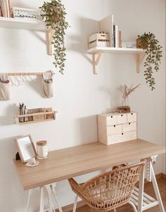 a wooden desk topped with lots of shelves filled with plants