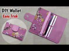 a pink wallet with flowers on it next to a pen and pencil holder in the shape of a flower