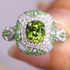 •Condition: Brand new•Center Stone: Natura Tsavorite Green Garnet, Cushion Shape, approx 1.15ct •Side Stone: Natural white diamond, round cut (VS1 clarity and F color)Natural Tsavorite round cut•Ring Weight: 5.62g (depend on the ring size)•Metal Purity: Optional Each piece is made-to-order with care and special attention to detail. all items are made with conflict-free diamonds and gems.Size: made to orderThe item will be gift wrapped and shipped.------------------------------------------------- Gia Certified Dazzling Green Diamond Ring, Gia Certified Green Diamond Ring, Dazzling Green Diamond Ring With Brilliant Cut, Dazzling Green Diamond Ring, Exquisite Green Diamond Ring With Brilliant Cut, Luxury Green Diamond Ring With Round Cut, Luxury Green Round Cut Diamond Ring, Oval Tsavorite Multi-stone Ring, Oval Multi-stone Tsavorite Rings