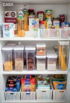 an organized pantry with plastic containers, food and other items on the shelves in it