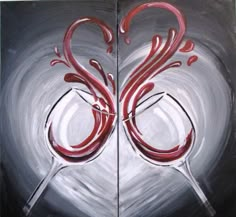 two wine glasses with red swirls are painted on canvases, one is black and the other is white