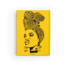 a yellow book with a drawing of a woman's head on top of it