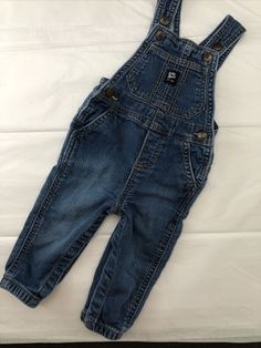 OshKosh B'Gosh 12M Baby Infant Unisex Denim Blue Jean Bib Overalls 100% Cotton. Casual Medium Wash Jeans For Playtime, Denim Blue Cotton Jeans For Playtime, Denim Blue Cotton Jeans, Cotton Jeans With Pockets For Playtime, Denim Dangri, Jean Skirt Fashion, Adorable Babies, Bib Overalls, Fashion Line