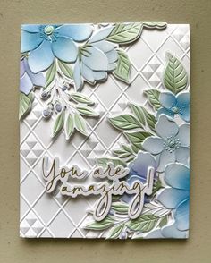 a close up of a card with flowers on it