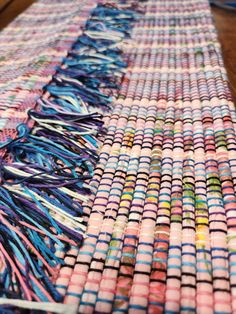 the table is covered with many different colored objects