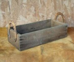 an old wooden box sitting on top of a table