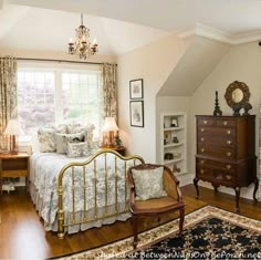 a bedroom with a bed, dresser and chair in it's centerpieces